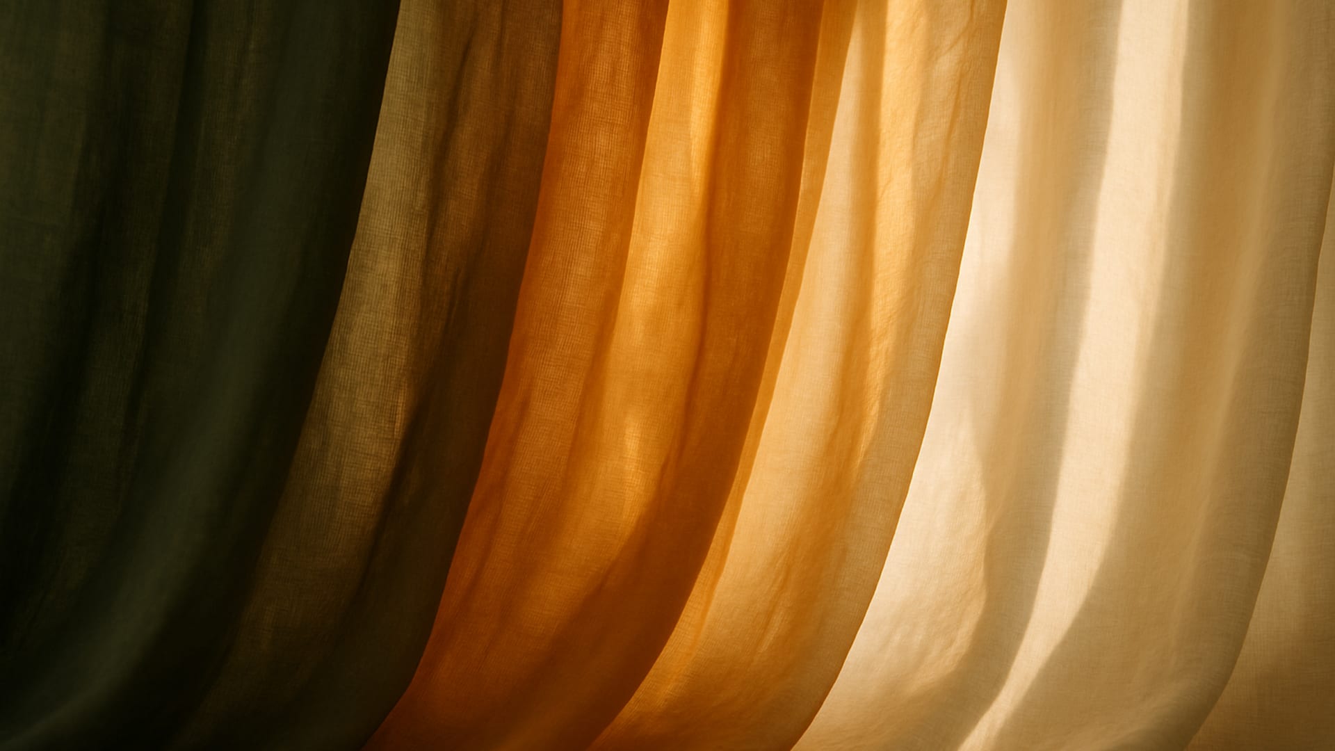 Layered sheer curtains in olive green, warm gold, and cream tones